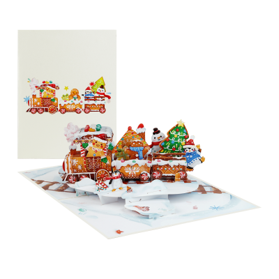 Handmade Gingerbread Train Pop Up Card with gingerbread cookies, candy decorations, penguin, snowman, and Christmas train in a festive winter scene.